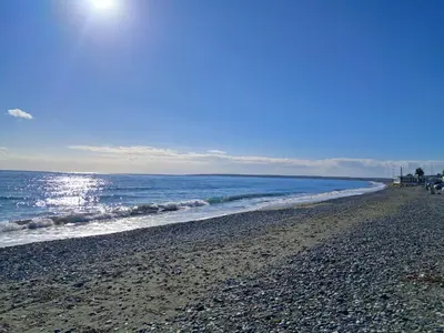 a sandy beach with the ocean in the background at ANDRIA'S luxury family studio near Casino limassol in Limassol