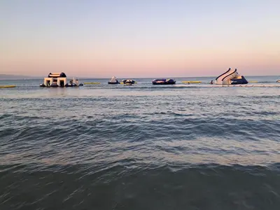 a group of boats in the water at sunset at ANDRIA'S luxury family studio near Casino limassol in Limassol
