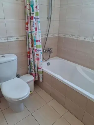 a bathroom with a toilet and a tub and a shower at MANDARIN Villa in Paralimni