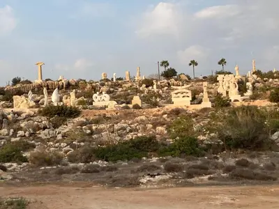 a group of ruins on a hill with palm trees at MANDARIN Villa in Paralimni