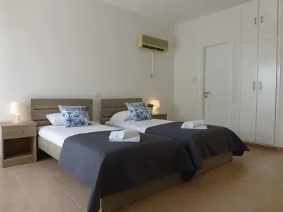 two beds in a room with two beds sidx sidx sidx sidx at STAY Paradise Sands Studio in Ayia Napa