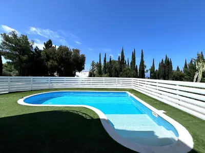 a swimming pool in a yard with a white fence at STAY ALKYONI Villa in Protaras