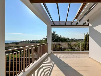 a balcony with a view of the ocean at Villa Aris in Ayios Theodhoros