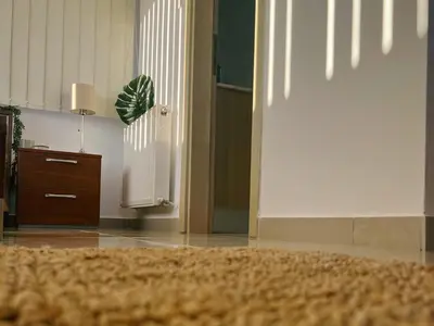 a room with a hallway with a door and a rug at Villa Aris in Ayios Theodhoros