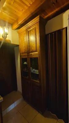 a wooden cabinet in a corner of a room at Archontikon 1817 in Kaliana