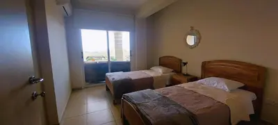 a hotel room with two beds and a window at Pyla Village Resort - F302 in Pyla