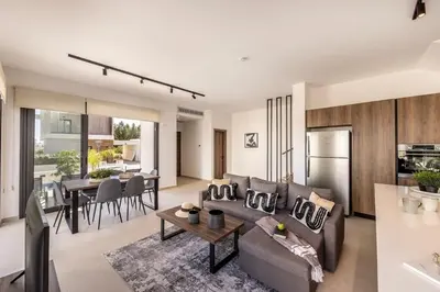a living room with a couch and a table at Villa Nissi 1 in Ayia Napa