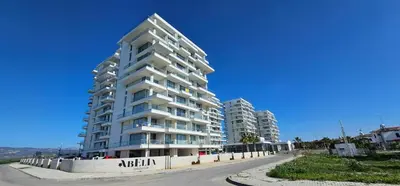 a tall apartment building on the side of a street at Muhteşem Deniz Manzaralı Stüdyo in Iskele