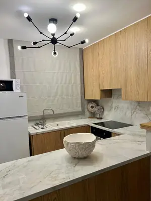 a kitchen with a large bowl on a counter at FatCow Beach Apartment Ultra in Larnaka