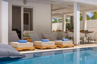 a villa with two beds and a swimming pool at Protaras Utopia in Protaras