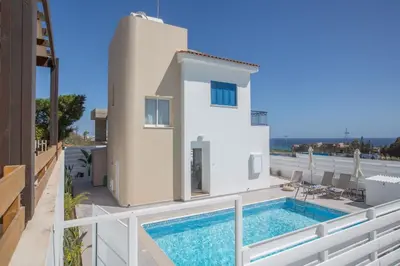 a villa with a swimming pool on a balcony at Narcissos Bay View Villa in Protaras