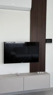 a flat screen tv on a white wall at ΘΕΑ 5 Comfortable 1BR and 2BR Apartments in Mor Menekshe