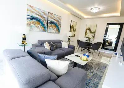 a living room with a couch and a table at Bloom of Luxury in Limassol