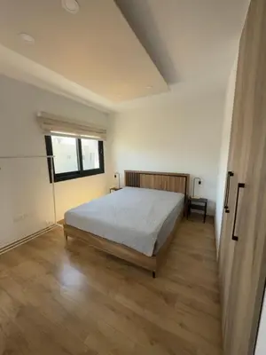 a bedroom with a large bed and a window at Stylish 2 bedroom apartment in Limassol in Limassol