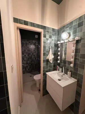 a bathroom with a sink and a toilet and a mirror at Mavrommati Luxury Residence no1 in Limassol