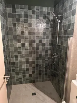a bathroom with a shower with a glass door at Mavrommati Luxury Residence no1 in Limassol