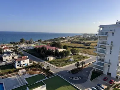 an aerial view of a city and the ocean at A peaceful apartment with sea views in Aglantzia