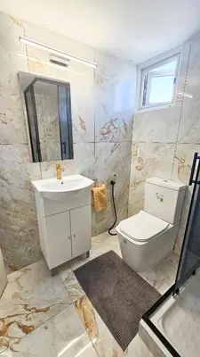 a bathroom with a sink and a toilet at Central Rooms, 500m to Larnaca Marina in Larnaka