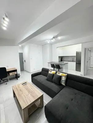 a living room with a couch and a table at Modern One-Bedroom Suite with Balcony in Central Nicosia in Nicosia