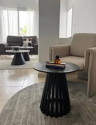 a living room with a table and a couch at The Catherine in Larnaka