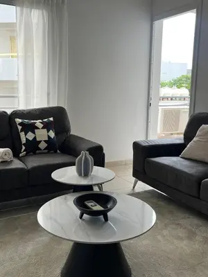 a living room with a couch and a coffee table at The Catherine in Larnaka