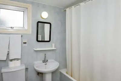 a bathroom with a sink and a toilet and a mirror at Sweet Memories STANDARD Apts in Protaras
