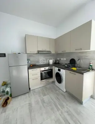 a kitchen with a white refrigerator and a dishwasher at 1 bedroom apartment in egkomi makedontissa near unic in Strovolos