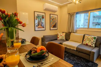a living room with a couch and a table at Boutique & Brand New Prime Location Park & Beach in Limassol