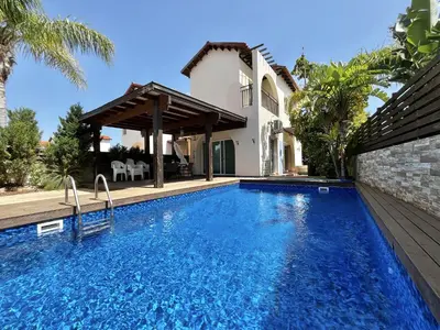 a swimming pool in front of a villa at STAY Thalassa Villa in Paralimni