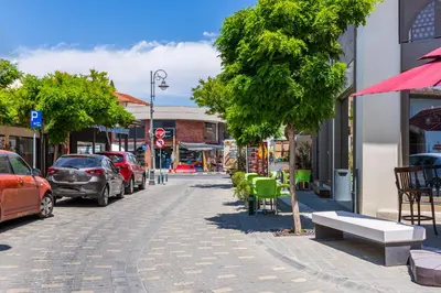 a street with cars parked on the side of the road at Le Bandit Studio in Larnaka