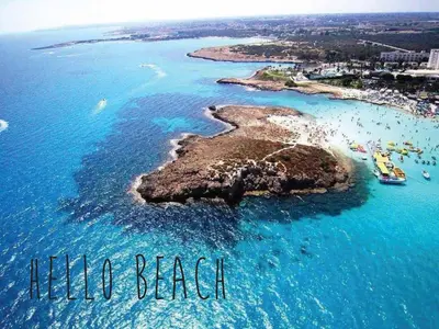 an island in the ocean with the words halo beach at Tsokkos Protaras Beach Hotel in Protaras