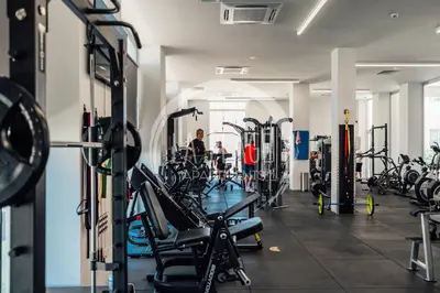 a gym with a lot of treadmills and machines at Cosy 2Br Family Apartment - Mythical Sands Resort in Paralimni