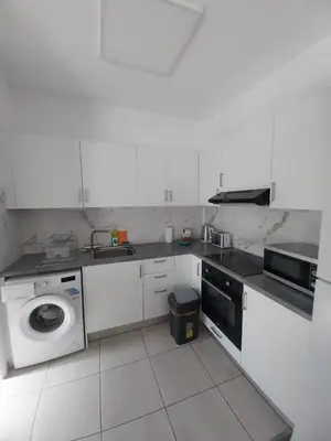 a kitchen with a washing machine and a dishwasher at 1 bd at Mediterranean Beach - Limassol Bay B206 in Limassol