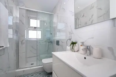 a bathroom with a shower and a sink and a toilet at Villa Brigita in Ayia Napa