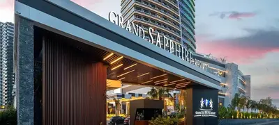 a building with a sign on the side of it at Grand Sapphire Resort & Casino in Phikardhou