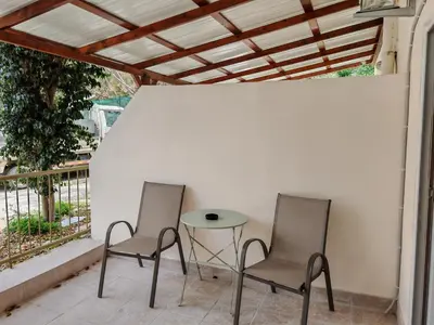 two chairs and a table on a patio at Studio in the center of Nicosia 3 in Nicosia