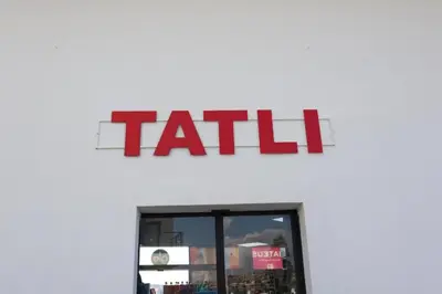 a tall sign on the side of a store at Seaview Apartment at Caesar Blue Complex Northern Cyprus H68 in Dherinia