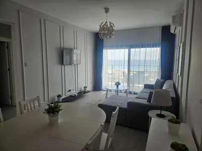 a living room with a couch and a table at Seaview Apartment at Caesar Blue Complex Northern Cyprus H68 in Dherinia