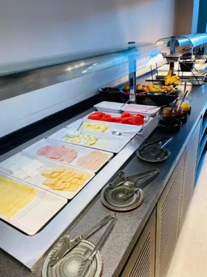 a buffet line with many different types of food at NÓA Rooms - Adults Only in Ayia Napa