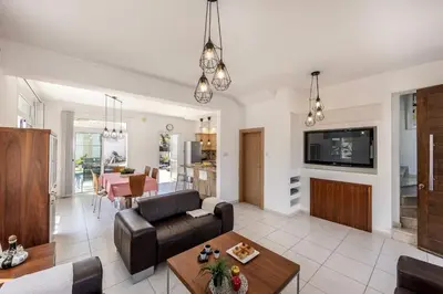 a living room with a couch and a table at Villa Parrog in Protaras