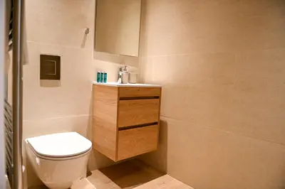 a small bathroom with a toilet and a sink at The 1 -Nicosia Elite Stay- Gym Pool 24h Concierge in Nicosia