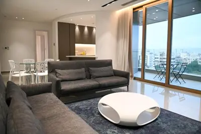 a living room with a couch and a table at The 1 -Nicosia Elite Stay- Gym Pool 24h Concierge in Nicosia
