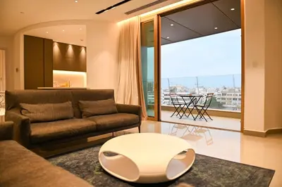 a living room with a couch and a table at The 1 -Nicosia Elite Stay- Gym Pool 24h Concierge in Nicosia