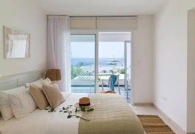 a bedroom with a bed with a hat on it at Sirena Solis Villa - Elegant 5-bedroom Sea View Retreat near Sirena Bay in Protaras