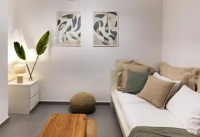 a living room with a couch and a table at Sirena Solis Villa - Elegant 5-bedroom Sea View Retreat near Sirena Bay in Protaras