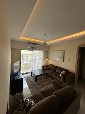 a living room with a couch and a table at 2 BR apartment in the Limassol with sea view in Limassol