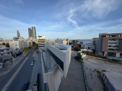 a view of a city with buildings and a street at 2 BR apartment in the Limassol with sea view in Limassol