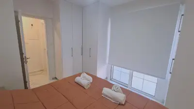 a room with two white pillows on a bed at STAY The Getaway Apartment in Pyla