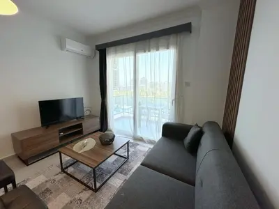 a living room with a couch and a tv at Cheap Holiday Opportunity in North Cyprus in Larnaka