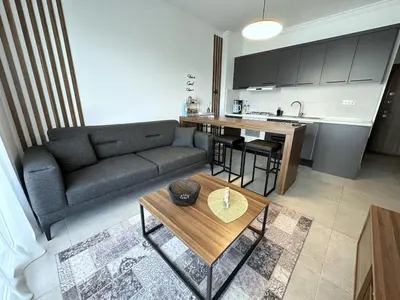 a living room with a couch and a table at Cheap Holiday Opportunity in North Cyprus in Larnaka
